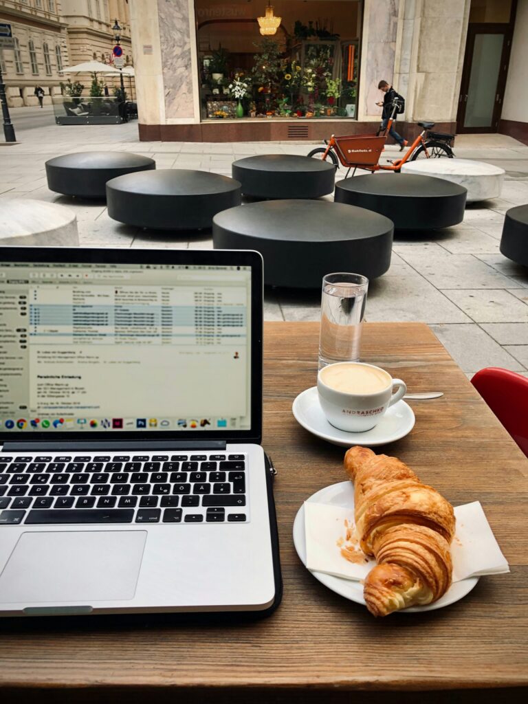 Laptop and breakfast in France