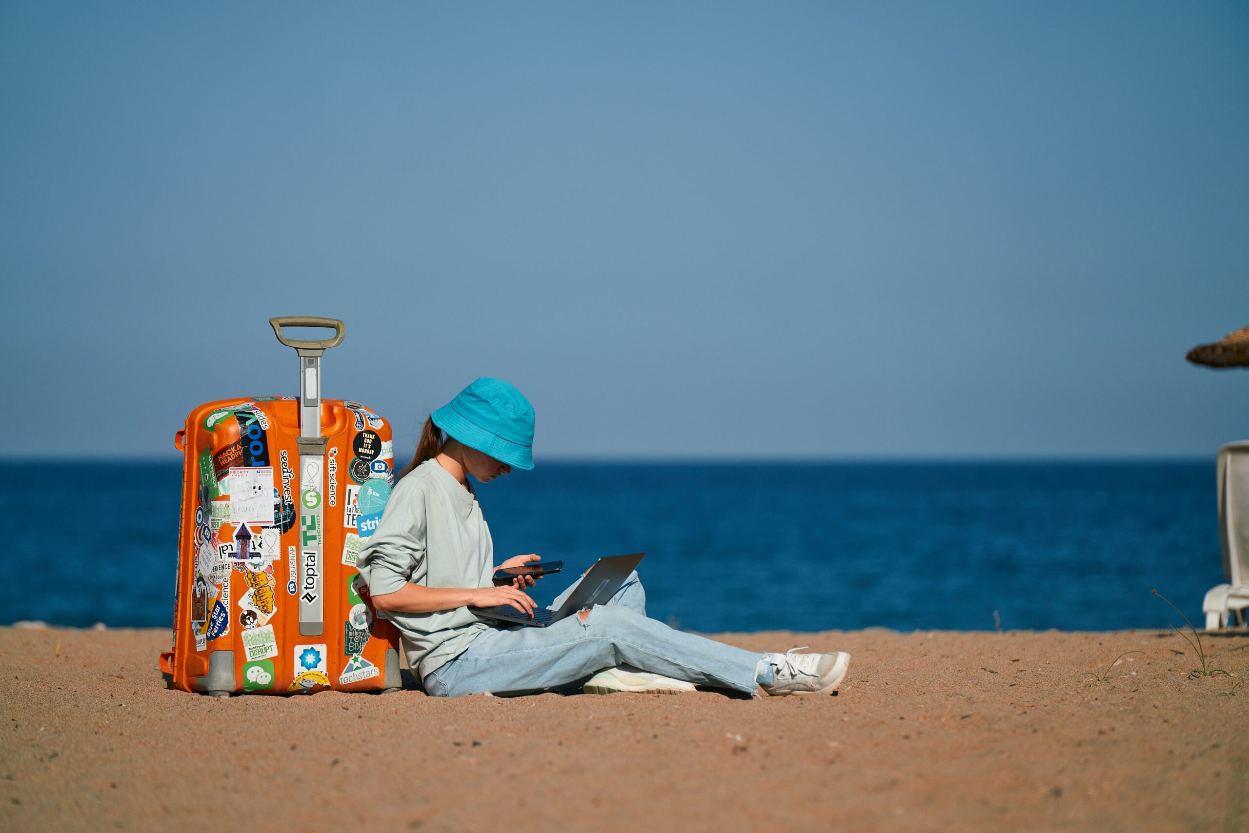 Digital nomad working on the beach